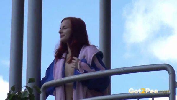 Watch this kinky redhead get a public surprise while peeing in the city - sexu.com on gratiscinema.com