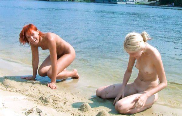 Slim and nude beach girl is trying to catch some sun as she displays her firm breasts - hclips.com on gratiscinema.com