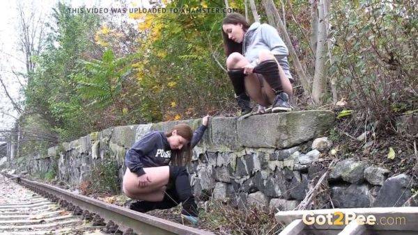 Watch these kinky girls get soaked in pee while getting frisky on the railway - sexu.com on gratiscinema.com