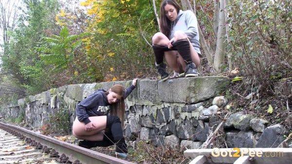 Brunette girls get desperate for a public pee session in the railway - sexu.com - Czech Republic on gratiscinema.com