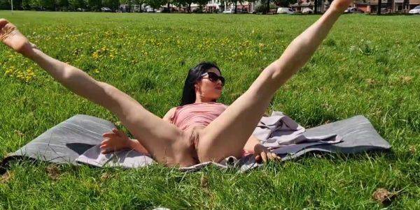 Brunette milf flashing pussy and pissing in a public park - anysex.com on gratiscinema.com